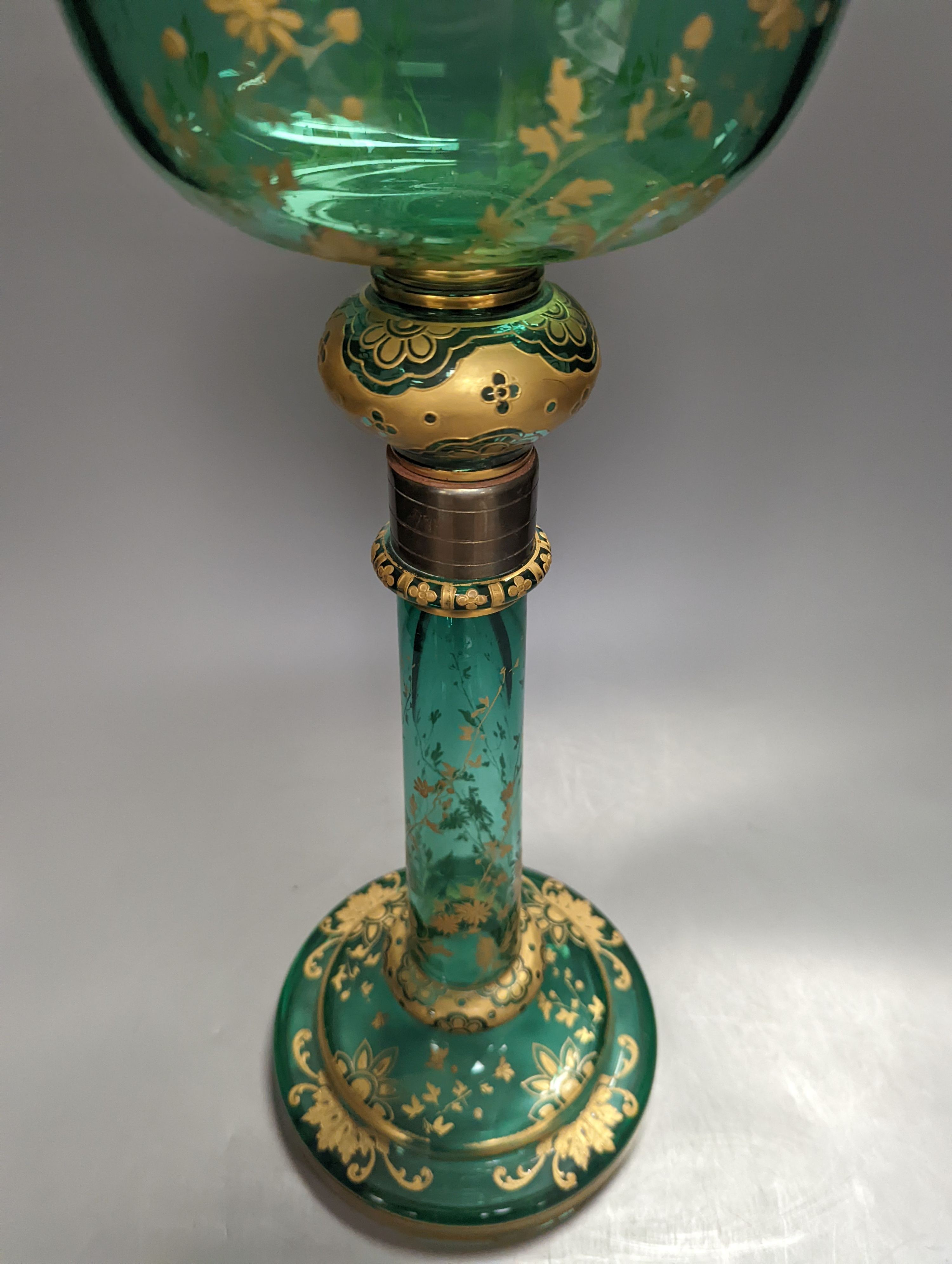 A tall Bohemian gilded green glass oil lamp, c.1900, height 48cm excl. light fitting